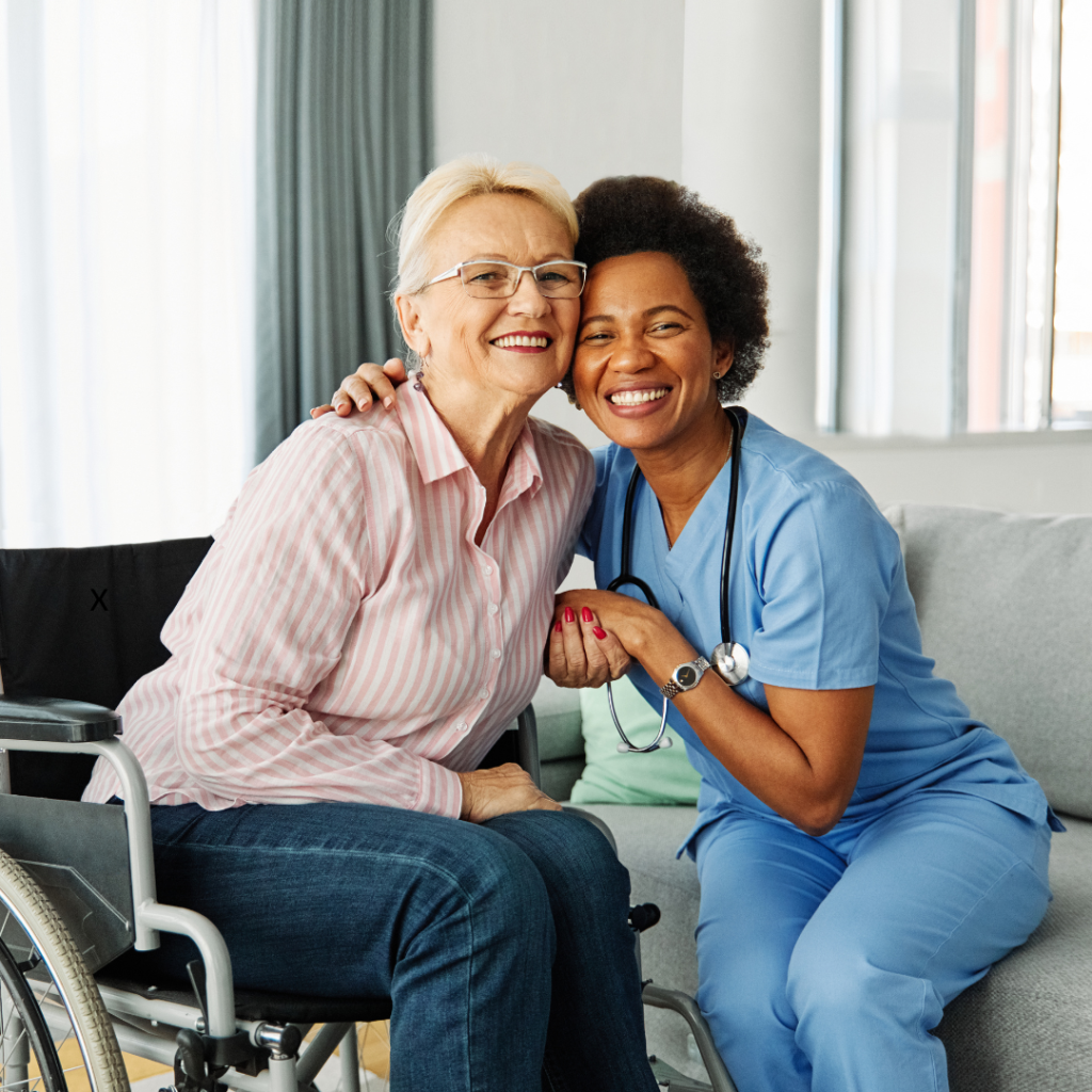 Elderly woman in wheelchair with doctor smiling